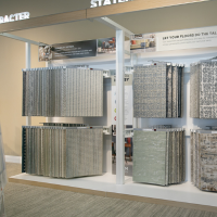 Neutral carpet samples displayed by style and pattern in a local flooring showroom.